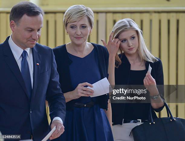 Andrzej Duda becomes the new President of the Republic of Poland, pictured as he arrives to casts his vote accompanied by wife Agata Kornhauser and...