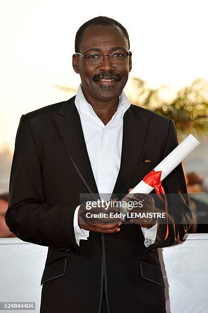 Mahamat-Saleh Haroun with the jury prize at the photo call for "The Palme d'Or Award Ceremony? during the 63rd Cannes International Film Festival.