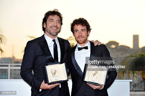 Javier Bardem and Elio Germano with their awards of Best Performance by an Actor at the photo call for "The Palme d'Or Award Ceremony? during the...