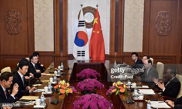 South Korean Foreign Minister Yun Byung-Se holds a talk with Chinese Foreign Minister Wang Yi during a meeting at the Diaoyutai State Guesthouse on...