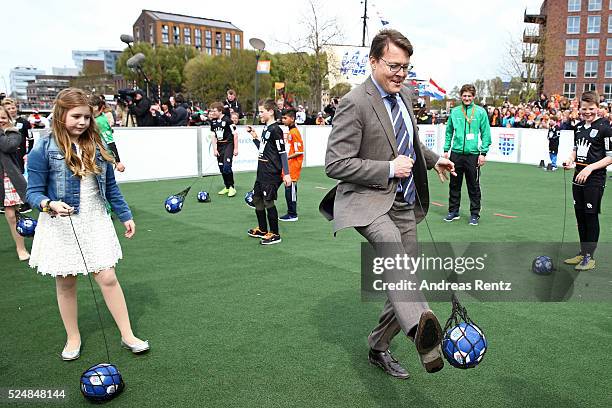 Princess Alexia of The Netherlands and Prince Constantijn of The Netherlands play football during King's Day , the celebration of the birthday of the...