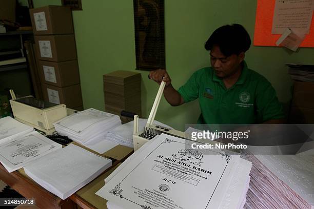 June 24 : A man printing a Braile Quran at Raudlatul Makfufin Foundation in Tangerang, outskrit of Jakarta, Indonesia, on June 24, 2015. Braille...