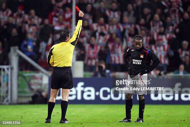 Soccer Champions League, season 2005-2006: PSV Eindhoven vs Olympique Lyonnais. Sidney Govou receives a red card from the referee.