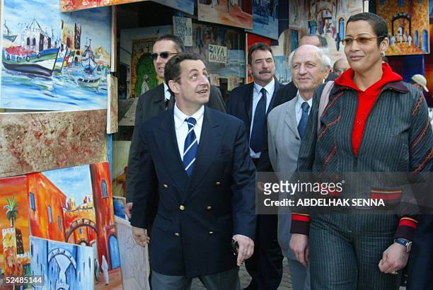 French ruling UMP party President Nicolas Sarkozy , Andres Azoulay , adviser to the king, and Asma Chaabi , mayor of Essaouira, visit the touristic...