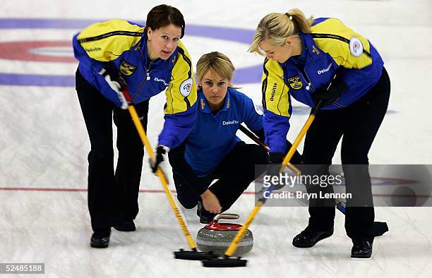 The Swedish curling team of Catherine Lindahl, Ulrika Bergman and Eva Lund in action during the World Women's Curling Championship final between USA...