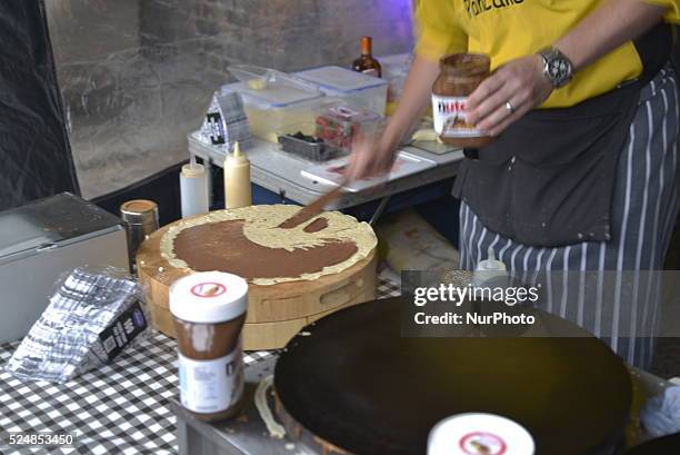 Chef spreading Nutella on to a pancake at a stall in Birmingham on Sunday 26th July 2015.