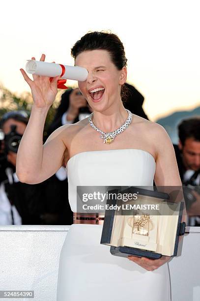 Juliette Binoche with his award of Best Performance by an Actress at the photo call for "The Palme d'Or Award Ceremony? during the 63rd Cannes...