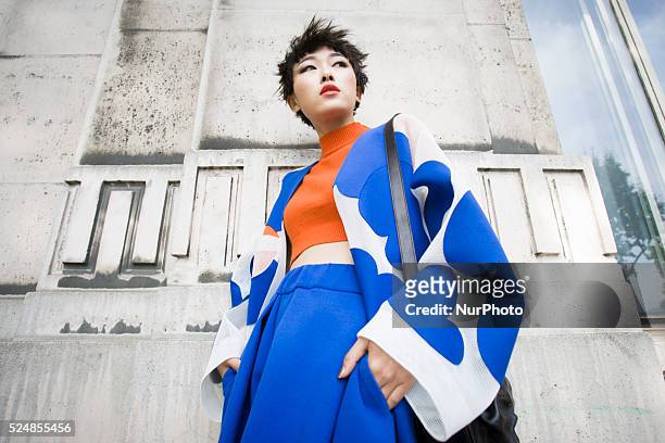 Invitees wait outside ahead of Chinese designer Masha Ma's show at the Monica Bismarck American Center on 4th October 2015. Outside less established...