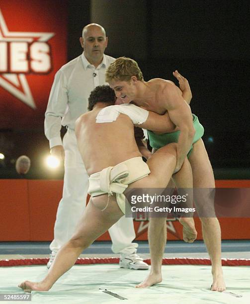 Craig Charles and Philip Olivier of the boys participates in the sumo wrestling Fina tournament on day three of the new series of the reality TV show...