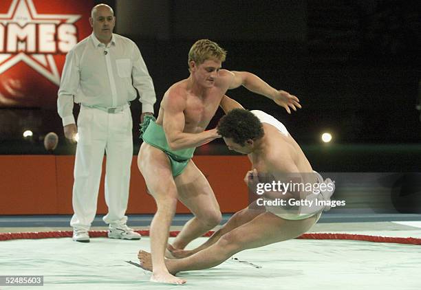 Craig Charles and Philip Olivier of the boys participate in the sumo wrestling Fina tournament on day three of the new series of the reality TV show...