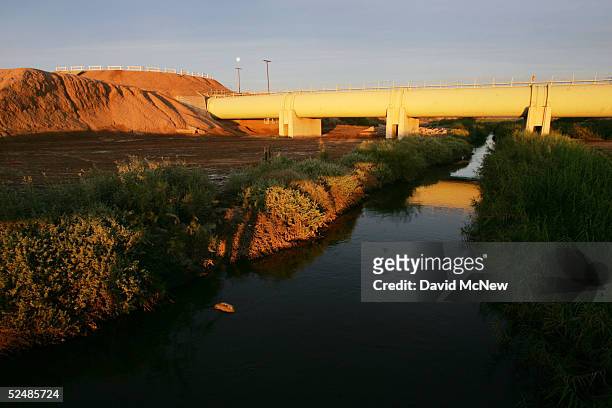 The New River, reportedly the most polluted river in the U.S. And down which illegal immigrants float across the U.S./Mexico border, is seen at dawn...