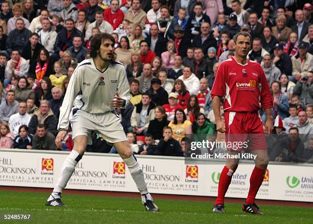 Alan Hansen and Sergio Pizzorno take part in the "Liverpool Legends v Celebrity XI" Tsunami Fundraiser football match at Anfield football ground on...