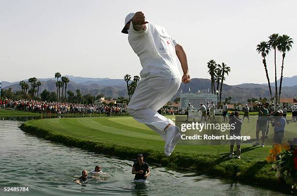 Terry McNamara, caddie for Annika Sorenstam of Sweden, jumps into Champions Lake as Annika, her sister Charlotta and mother Gunilla celebrate in the...