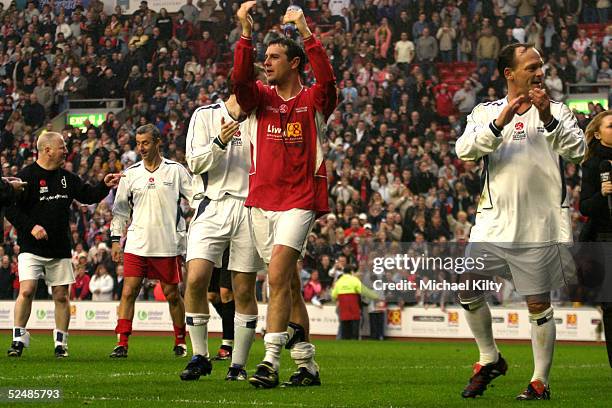 Perry Fenwick and Partick McGuiness take part in the "Liverpool Legends v Celebrity XI" Tsunami Fundraiser football match at Anfield football ground...