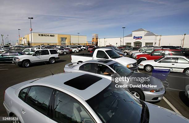 Cars fill the parking lot of the new Imperial Valley Mall, a major project in the city of El Centro on March 27, 2005 near Calexico, California. As...