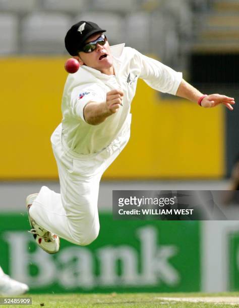 New Zealand fieldsman Lou Vincent dives in an attempt to catch an Australian batsman on the third day of the third Test match at Eden Park in...