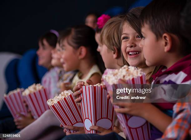 group of kids at the cinema - children theatre audience stock pictures, royalty-free photos & images