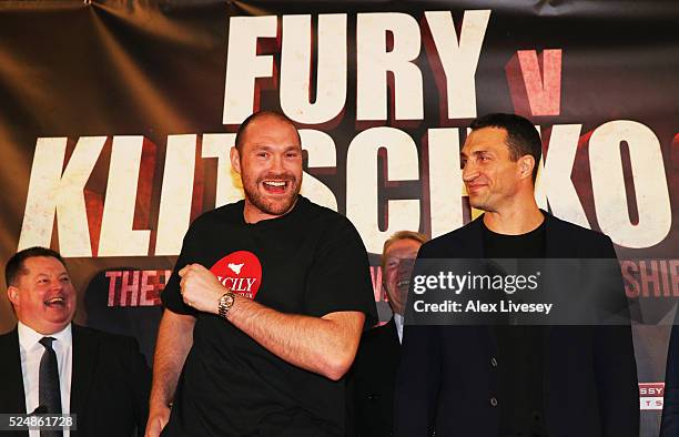 Reigning WBO, WBA and IBO heavyweight champion Tyson Fury dances alongside Wladimir Klitschko during Tyson Fury and Wladimir Klitschko head to head...