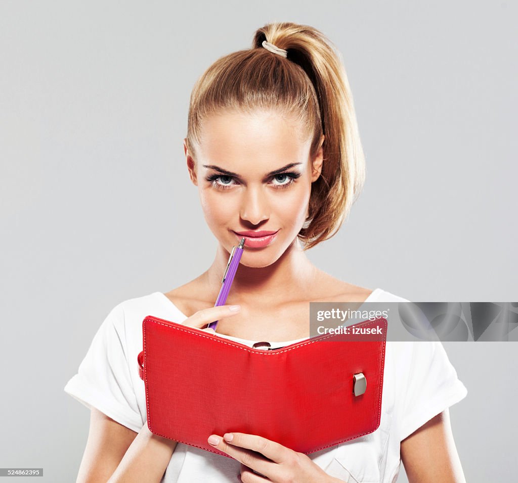 Young woman with calendar