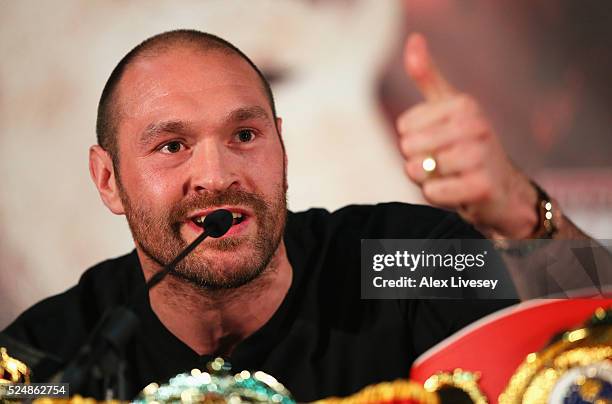 Reigning WBO, WBA and IBO heavyweight champion Tyson Fury gives a thumbs up during Tyson Fury and Wladimir Klitschko head to head press conference at...