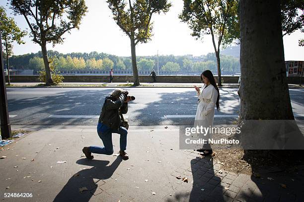 Invitees wait outside ahead of Chinese designer Masha Ma's show at the Monica Bismarck American Center on 4th October 2015. Outside less established...