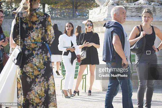 Models, photographers and fashion professionals are seen gathering outside the shows during Paris Fashion Week. Formal shows take place on the runway...