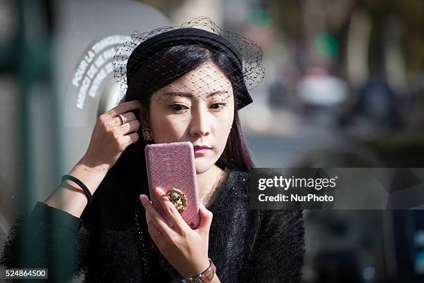 Invitees wait outside ahead of Chinese designer Masha Ma's show at the Monica Bismarck American Center on 4th October 2015. Outside less established...