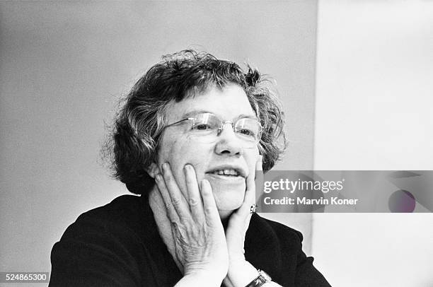 American cultural anthropologist Margaret Mead holds her hands up to her face, circa 1955.