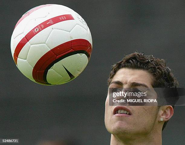 Portugal's player Cristiano Ronaldo watches the ball during the training at the 1de Maio Stadium, in Braga, northern Portugal, 28 March 2006, before...