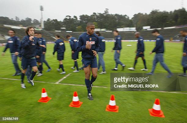 Portugal's players warm up during a training session at the 1de Maio Stadium, in Braga, northern Portugal, 28 March 2006, before their FIFA World Cup...