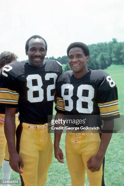 Wide receivers John Stallworth and Lynn Swann of the Pittsburgh Steelers pose for photographers during summer training camp at St. Vincent College in...