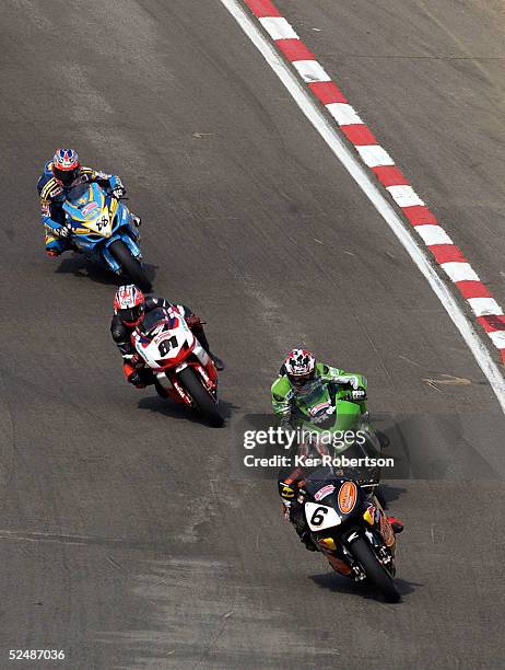 Ryuichi Kiyonari of Japan leads the field down Paddock Hill on his HM Plant Honda during race one of the Bennetts British Superbike Championship...