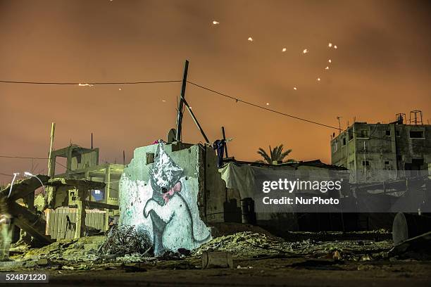 Graffitis are seen on a wall of a building, drawn by British artist Banksy in Beit Hanoun, Gaza Famous British artist Banksy visited Gaza and drew...