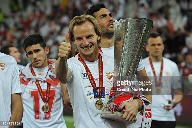 Ivan Rakitic of Sevilla poses with the trophy at the end of the UEFA Europa League final football match between Sevilla FC and SL Benfica Football /...