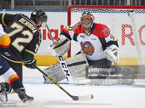 Devin Williams of the Erie Otters gets set to face a blast off the stick of Aaron Berisha of the London Knights during Game Three of the OHL Western...