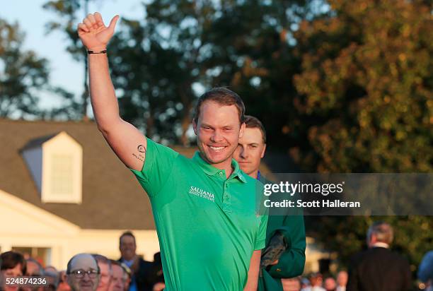 Danny Willett of England celebrates his victory as Jordan Spieth looks on after the final round of the 2016 Masters Tournament at the Augusta...