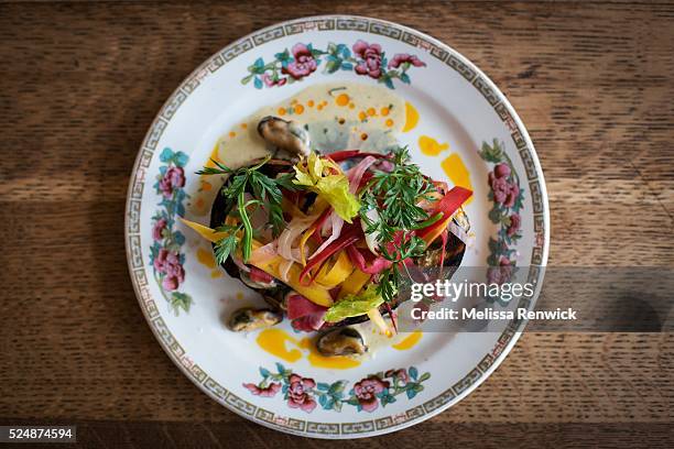 Head chef, Duncan Simpson, prepares mussels on toast with house made white bread, mussels steamed with cider and cream, finished with pickled carrots...