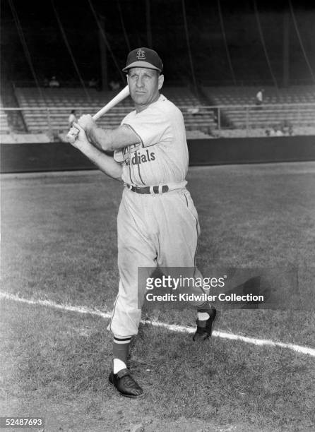 S: Outfielder Enos Slaughter of the St. Louis Cardinals poses for an action portrait prior to a game in the early 1950's against the New York Giants...