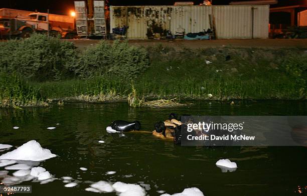 Group of people use inner tubes to float down the New River, reportedly the most polluted river in the US, after illegally crossing the US/Mexico...