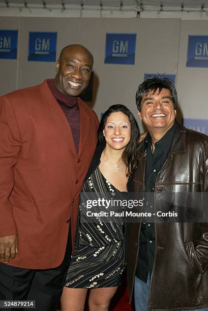 Actor Michael Clarke Duncan, his wife Irene, and actor and comedian George Lopez arrive at the third annual "Ten" fashion show and charity event...