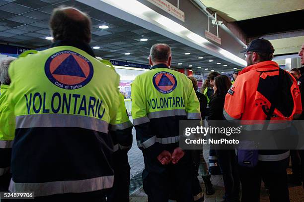 Some volunteers of the Civil Defense Region Piedmont awaits the arrival of the two trains from Lourdes after the flood in French Riviera. Turin,...