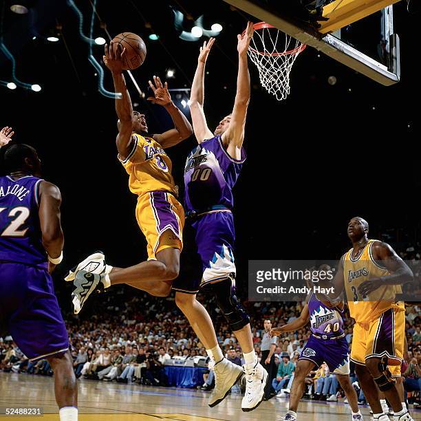 Kobe Bryant of the Los Angeles Lakers drives to the basket against the Utah Jazz during Game Four and Round Two of the 1997 NBA Western Conference...