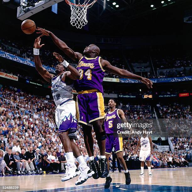 Shaquille O'Neal of the Los Angeles Lakers goes blocks a shot by Karl Malone of the Utah Jazz during Game Two and Round Two of the 1997 NBA Western...