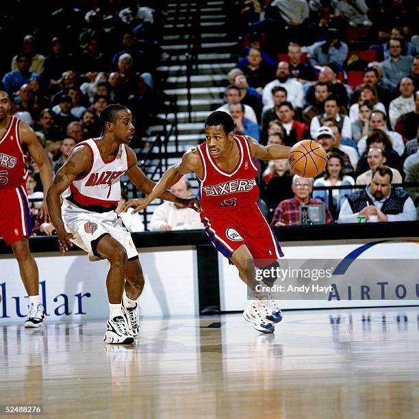 Allen Iverson of the Philadelphia 76ers dribble drives to the basket against the Portland Trail Blazers on March 2, 1997 at the The Rose Garden in...