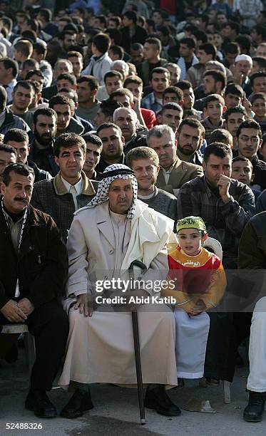 Palestinians participate in a pro-election rally organized by the Fatah movement March 28, 2005 in the Beit Lahyea Refugee Camp near the Israeli...