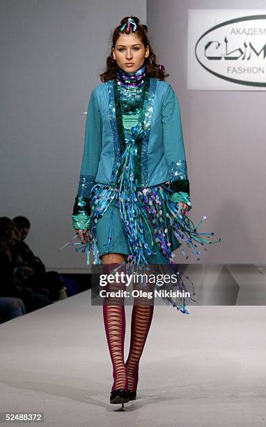 Model walks down the runway to introduce a new collection by Symbat fashion academy from Kazakhstan during the Moscow Fashion Week March 28, 2005 in...