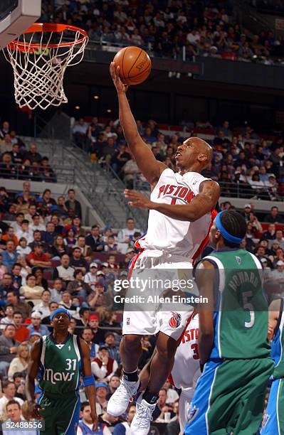 Chauncey Billups of the Detroit Pistons drives against Josh Howard of the Dallas Mavericks on March 28, 2005 at the Palace of Auburn Hills, in Auburn...