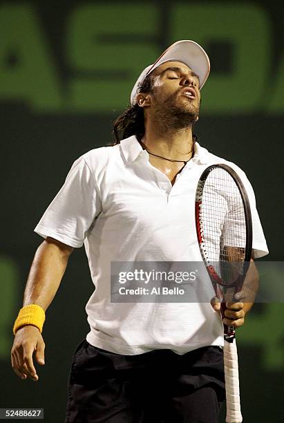 Mariano Zabaleta of Argentina reacts to a missed point against Roger Federer of Switzerland during the NASDAQ-100 Open at the Crandon Park Tennis...