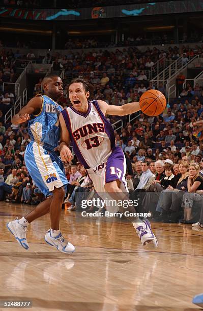 Steve Nash of the Phoenix Suns drives against Voshon Lenard of the Denver Nuggets on March 28, 2005 at America West Arena in Phoenix, Arizona. NOTE...