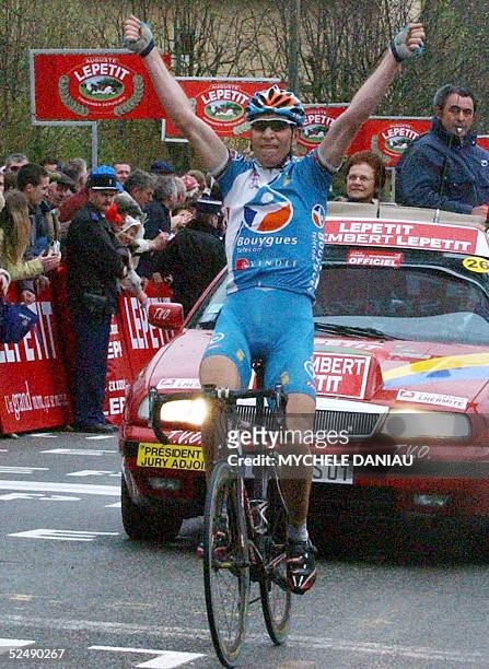 Frenchman Laurent Brochard celebrates as he crosses first the finish line of the Paris-Camembert semi-classic race, 29 March 2005 in Vimoutiers. AFP...